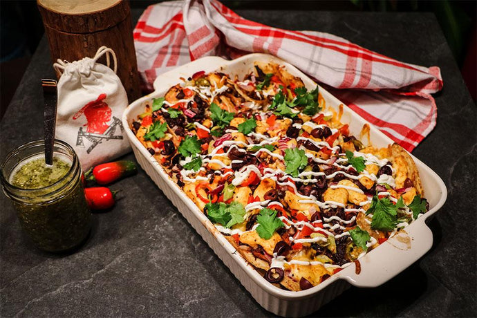 Nachos with frayed pork with spices tomahawk